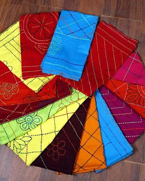 Nokshi katha in many colors, folded into a fan